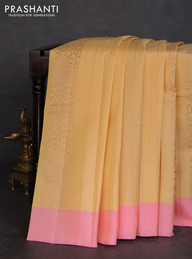Kanchipuram silk saree pale yellow and light pink with allover copper zari weaves and simple border