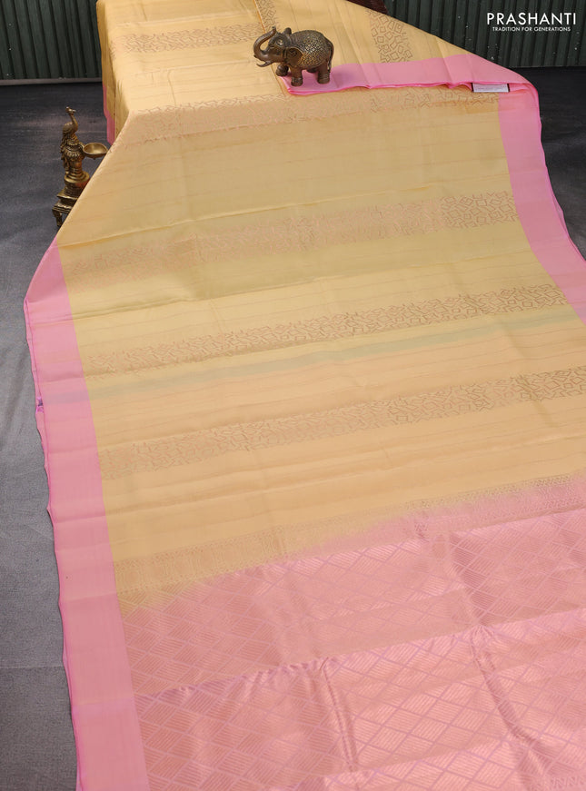 Kanchipuram silk saree pale yellow and light pink with allover copper zari weaves and simple border