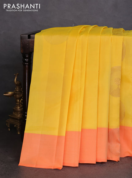 Kanchipuram silk saree yellow and orange with coppper zari woven buttas and simple border