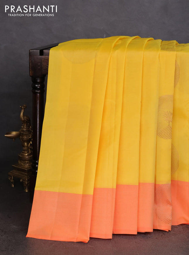Kanchipuram silk saree yellow and orange with coppper zari woven buttas and simple border