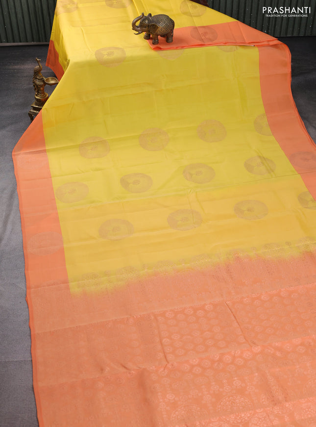 Kanchipuram silk saree yellow and orange with coppper zari woven buttas and simple border