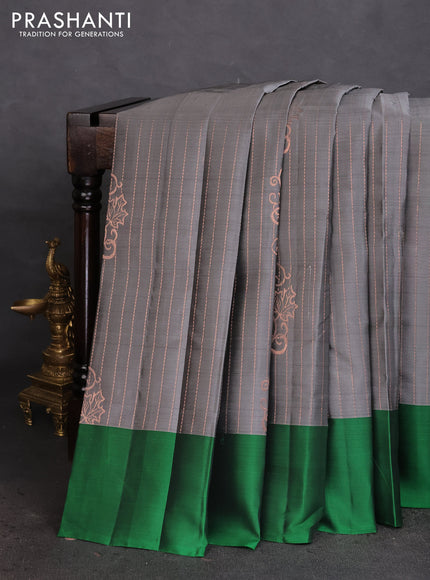 Kanchipuram silk saree grey and green with allover copper zari weaves and simple border
