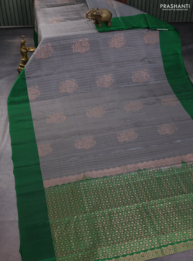 Kanchipuram silk saree grey and green with allover copper zari weaves and simple border
