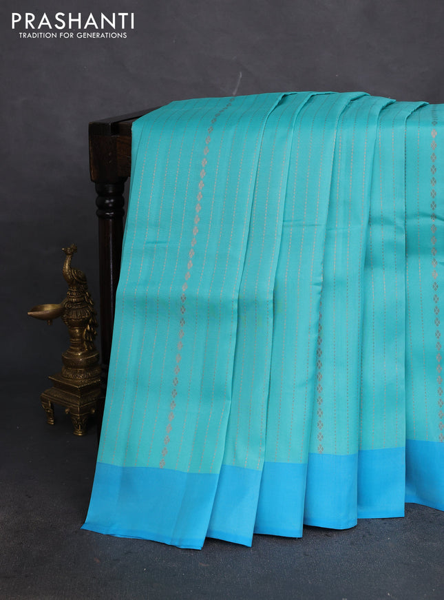 Kanchipuram silk saree teal blue and blue with allover copper zari weaves and simple border