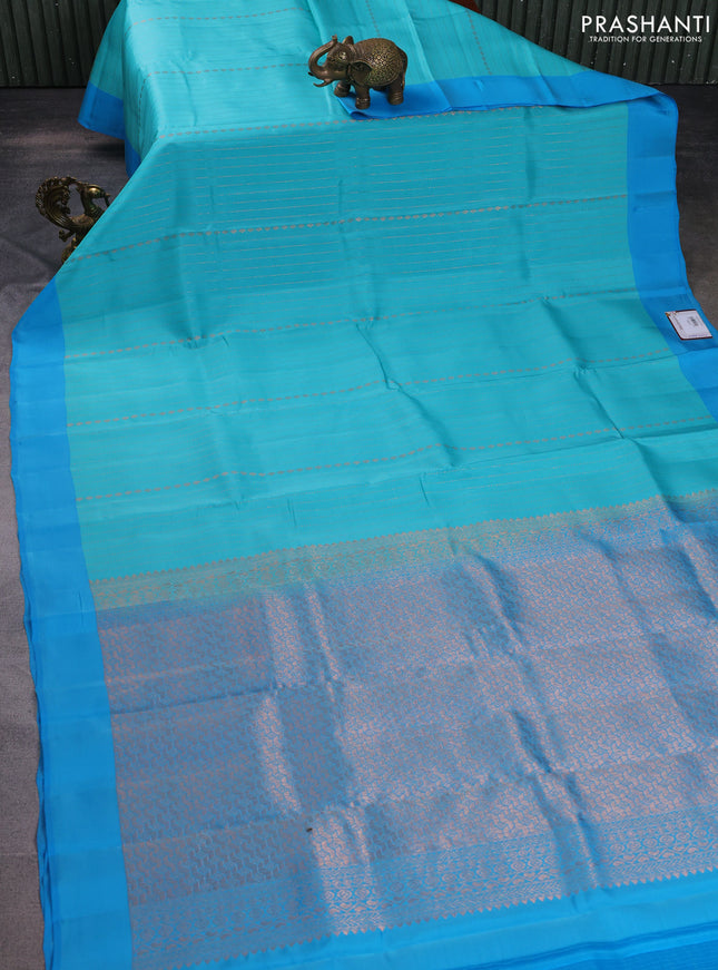 Kanchipuram silk saree teal blue and blue with allover copper zari weaves and simple border