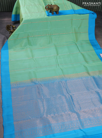 Kanchipuram silk saree teal green shade and blue with allover copper zari weaves and simple border