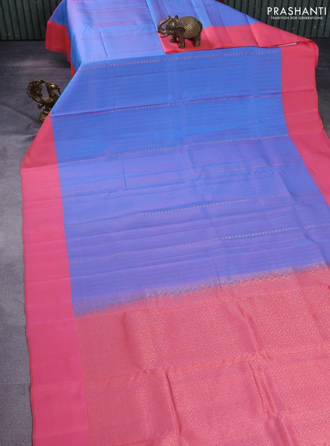Kanchipuram silk saree dual shade of blue and peach pink with allover copper zari weaves and simple border