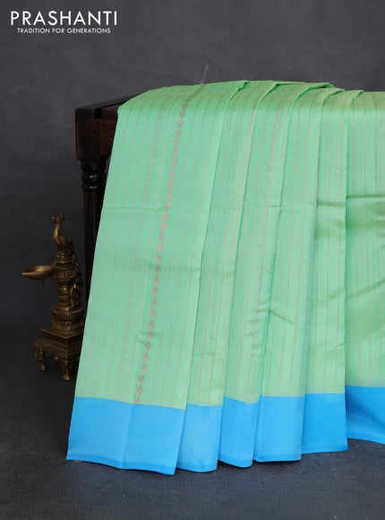 Kanchipuram silk saree teal green shade and blue with allover copper zari weaves and simple border