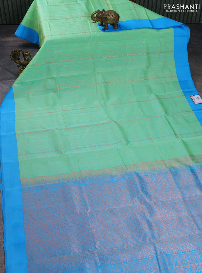 Kanchipuram silk saree teal green shade and blue with allover copper zari weaves and simple border