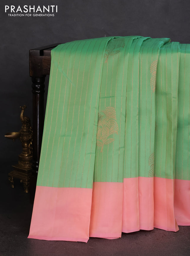 Kanchipuram silk saree teal green shade and peah pink with allover copper zari weaves and simple border