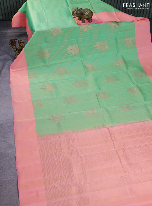 Kanchipuram silk saree teal green shade and peah pink with allover copper zari weaves and simple border
