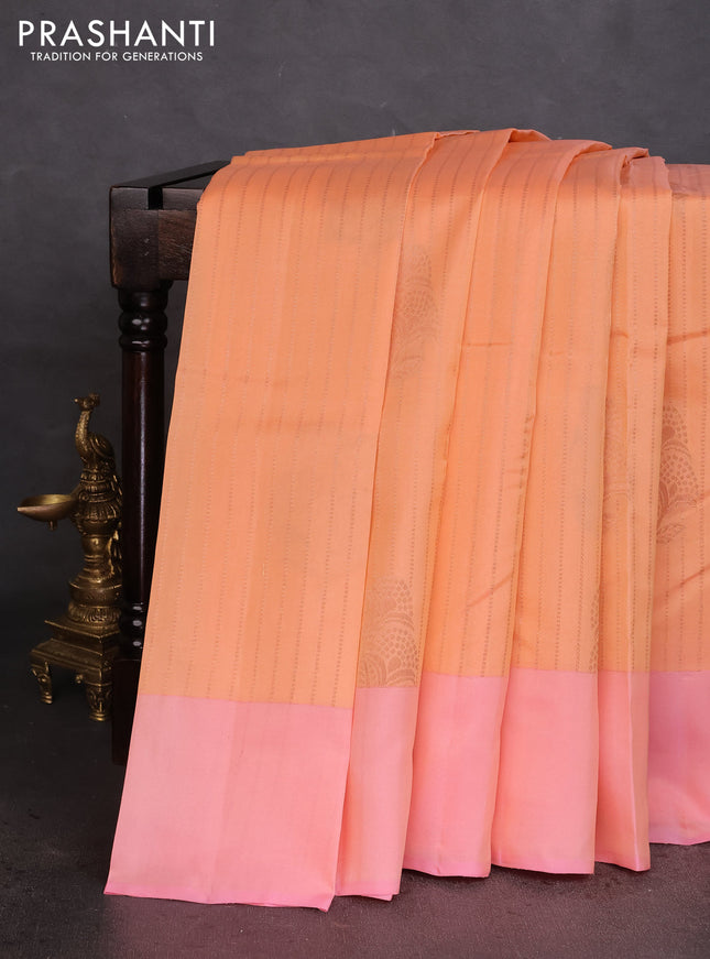 Kanchipuram silk saree peach orange and peach pink with allover copper zari weaves and simple border