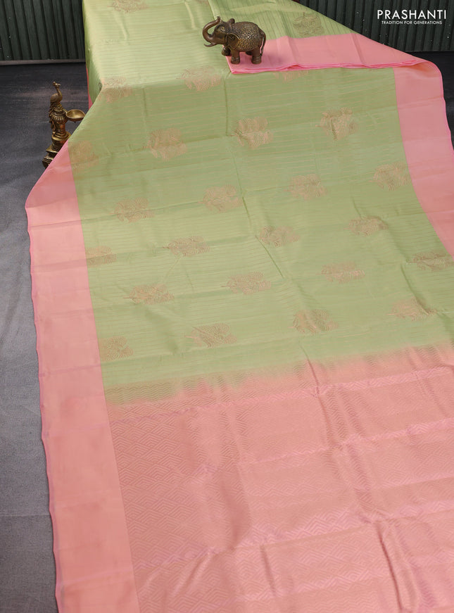 Kanchipuram silk saree pista green and peach pink with allover copper zari weaves and simple border