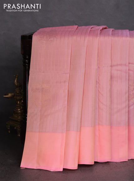 Kanchipuram silk saree dual shade of peach and pieach pink with allover copper zari weaves and simple border