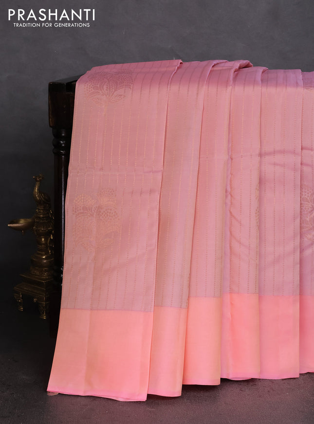 Kanchipuram silk saree dual shade of peach and pieach pink with allover copper zari weaves and simple border