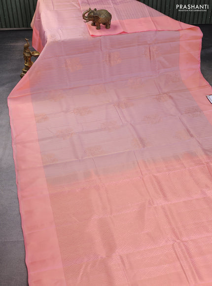 Kanchipuram silk saree dual shade of peach and pieach pink with allover copper zari weaves and simple border