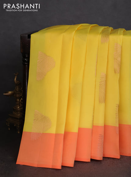 Kanchipuram silk saree yellow and orange with copper zari woven buttas and copper zari woven butta border