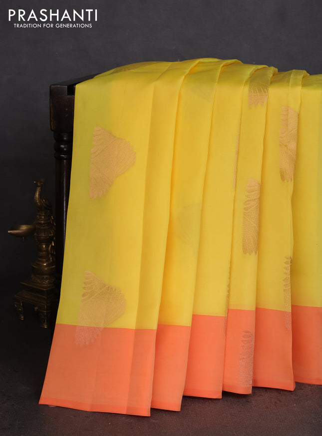 Kanchipuram silk saree yellow and orange with copper zari woven buttas and copper zari woven butta border