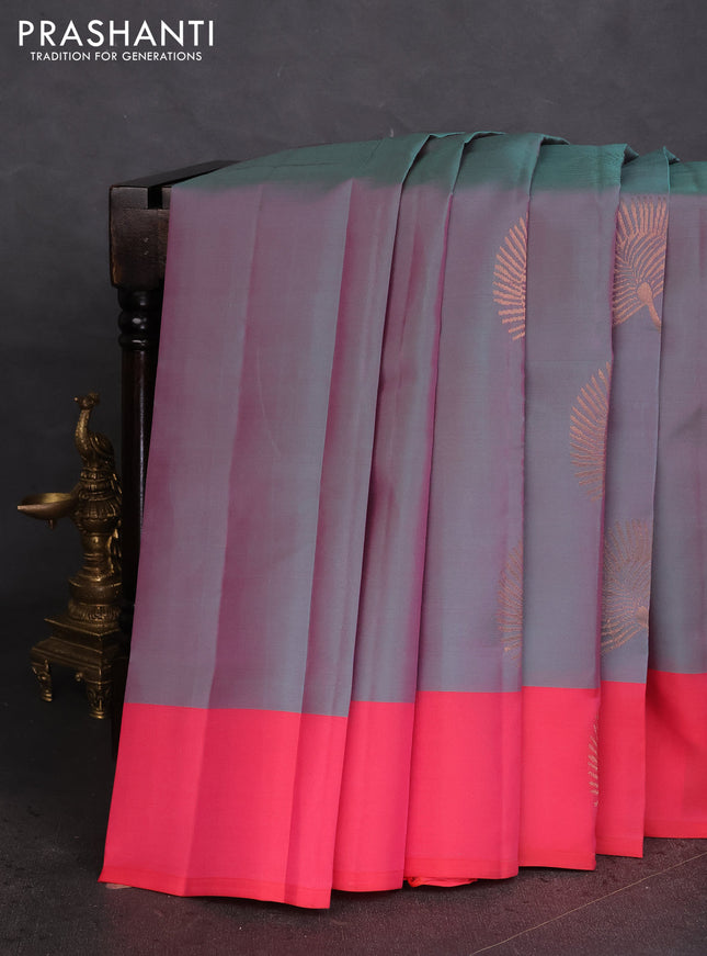 Kanchipuram silk saree dual shade of teal bluish pink and pink with copper zari woven buttas and copper zari woven butta border
