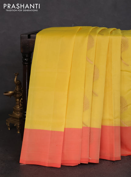 Kanchipuram silk saree yellow and peach orange with copper zari woven buttas and copper zari woven butta border
