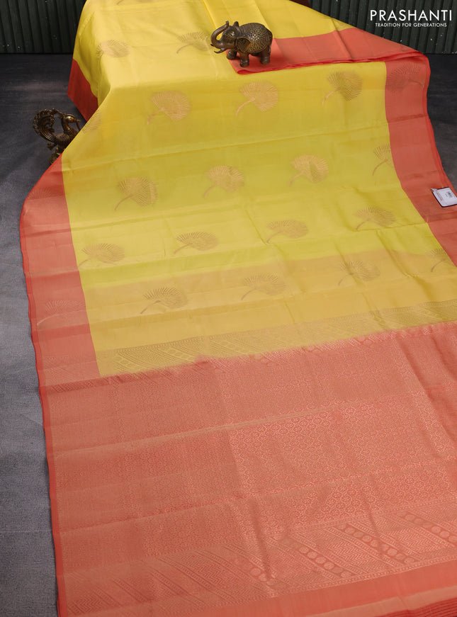 Kanchipuram silk saree yellow and peach orange with copper zari woven buttas and copper zari woven butta border