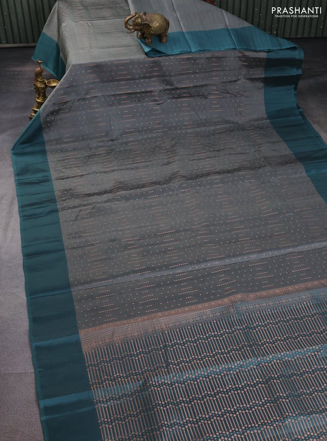 Kanchipuram silk saree grey and pastel green with allover copper zari weaves and simple border