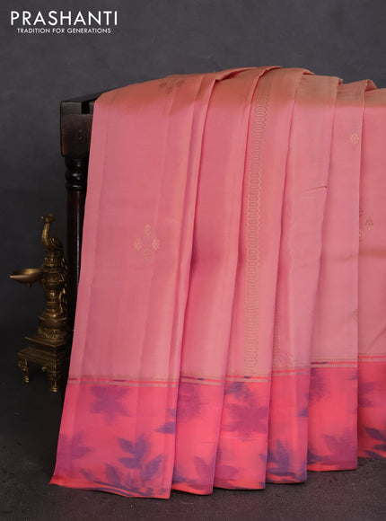 Kanchipuram silk saree pastel peach and peach orange with allover copper zari weaves and zari woven ikat style border