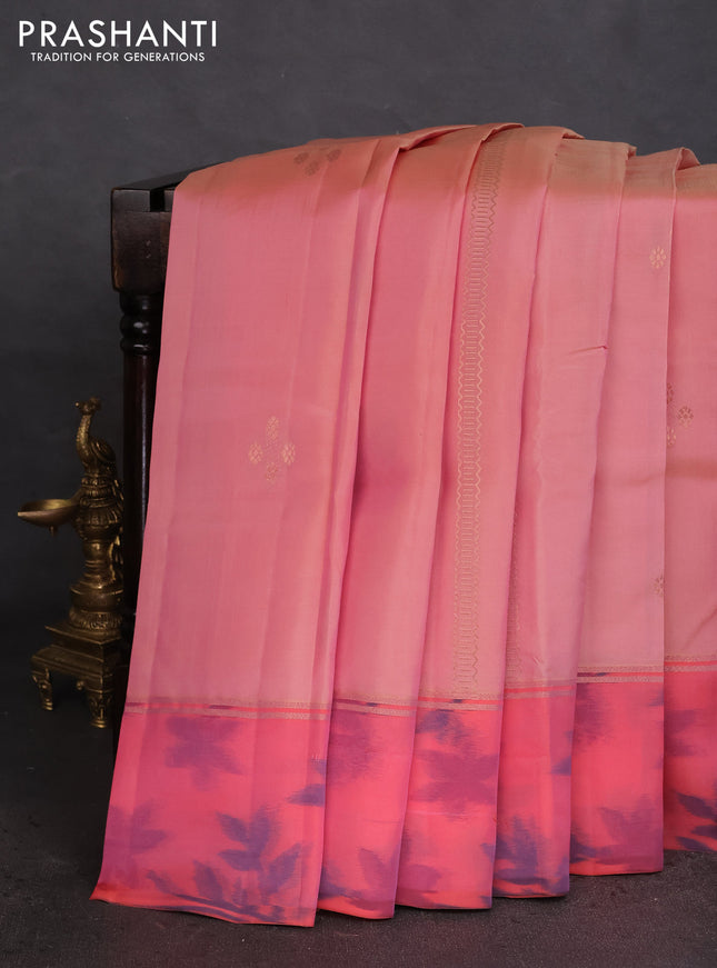 Kanchipuram silk saree pastel peach and peach orange with allover copper zari weaves and zari woven ikat style border
