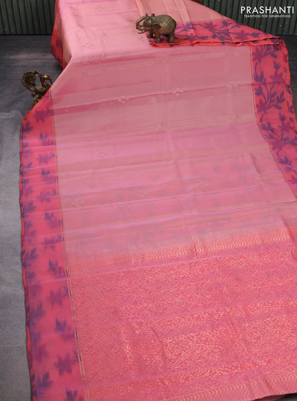 Kanchipuram silk saree pastel peach and peach orange with allover copper zari weaves and zari woven ikat style border