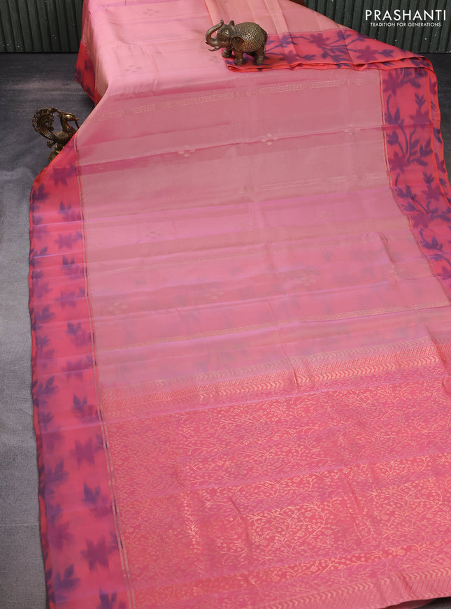 Kanchipuram silk saree pastel peach and peach orange with allover copper zari weaves and zari woven ikat style border