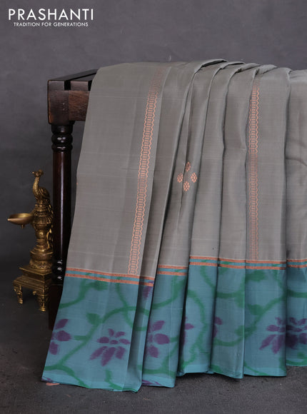 Kanchipuram silk saree grey and teal green shade with allover copper zari weaves and zari woven ikat style border