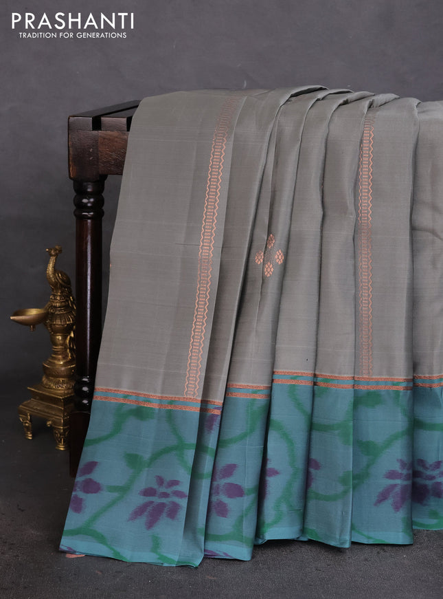 Kanchipuram silk saree grey and teal green shade with allover copper zari weaves and zari woven ikat style border