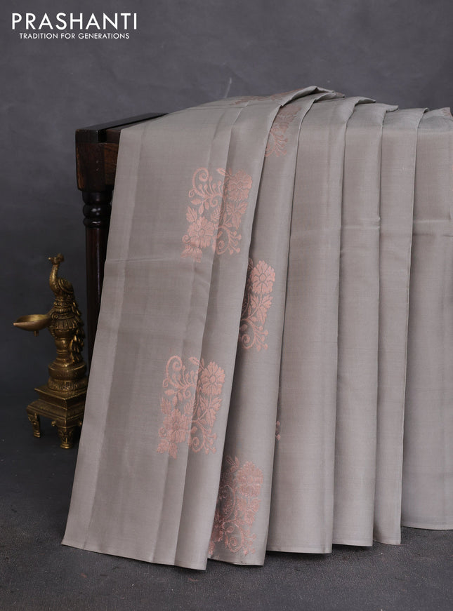 Kanchipuram silk saree grey and dual shade of pinkish orange with copper zari woven floral buttas in borderless style