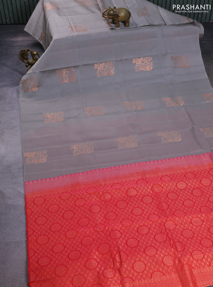 Kanchipuram silk saree grey and dual shade of pinkish orange with copper zari woven floral buttas in borderless style