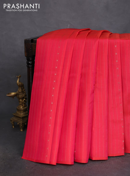 Kanchipuram silk saree dual shade of pinkish orange and teal blue with allover zari weaves in borderless style