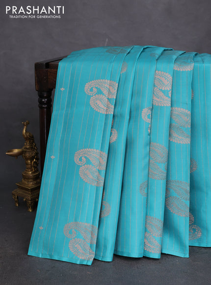 Kanchipuram silk saree teal blue and light pink with allover zari weaves in borderless style