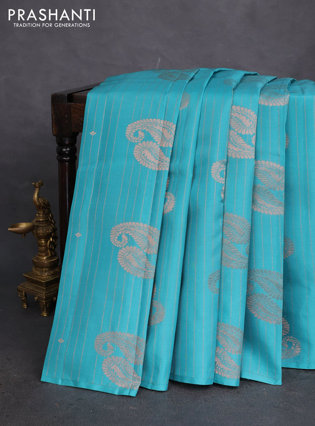 Kanchipuram silk saree teal blue and light pink with allover zari weaves in borderless style