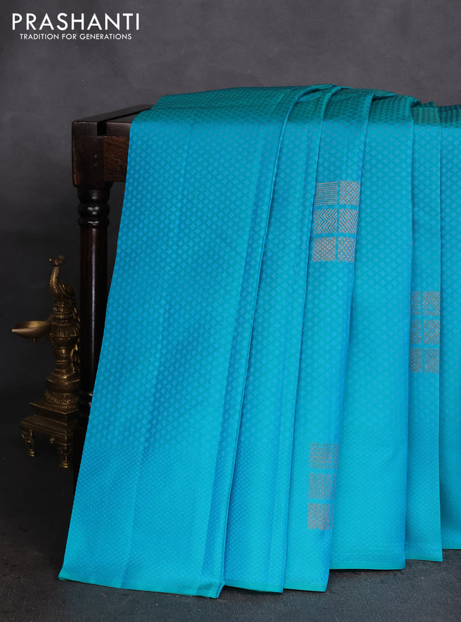 Kanchipuram silk saree dual shade of teal bluish pink and dark peach pink with allover self emboss & zari buttas in borderless style