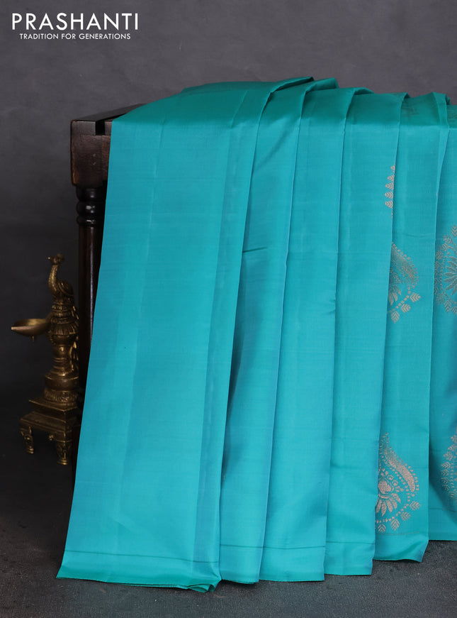 Kanchipuram silk saree teal blue and pinkish orange with copper zari woven buttas in borderless style