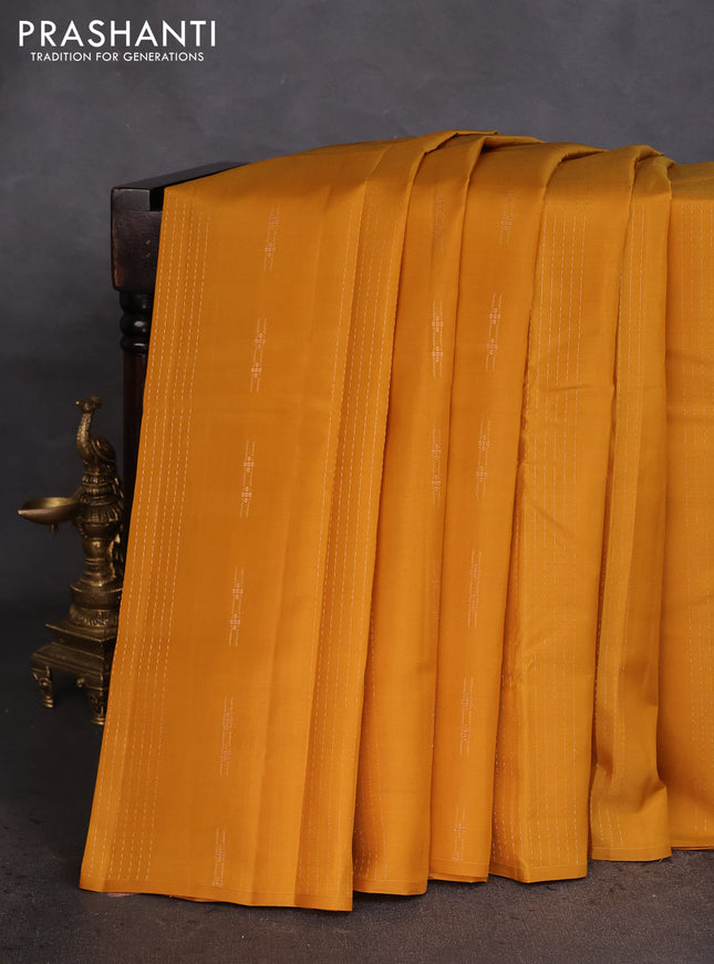 Kanchipuram silk saree dark mustard and teal green with allover zari weaves in borderless style