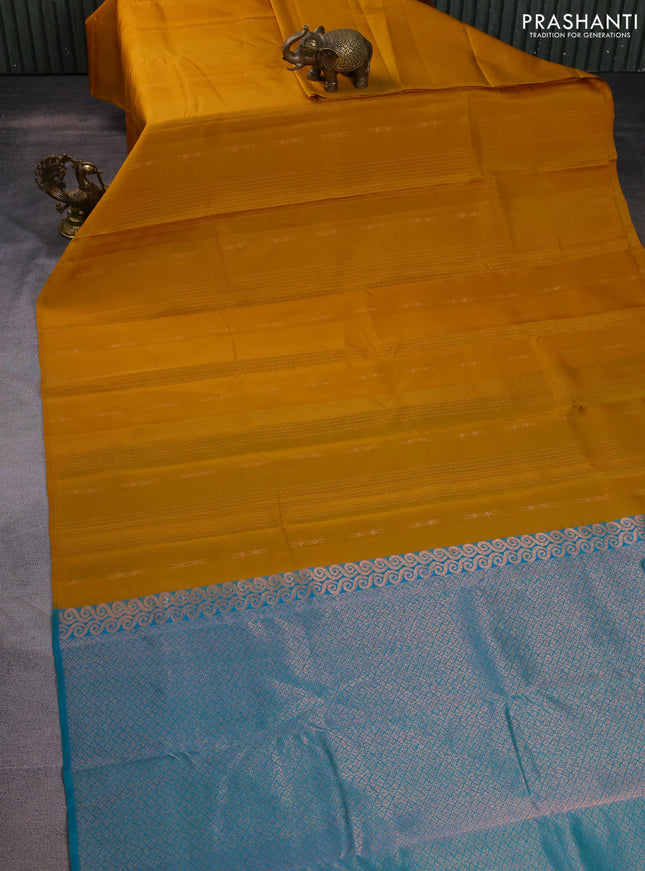 Kanchipuram silk saree dark mustard and teal green with allover zari weaves in borderless style