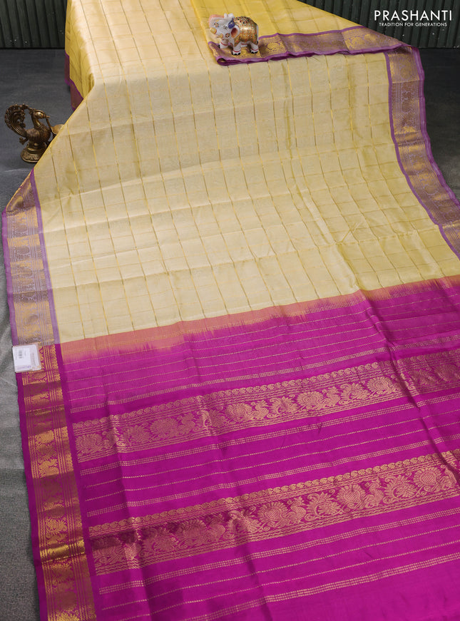 Silk cotton saree pale yellow and purple with zari checked pattern and rettapet zari woven border
