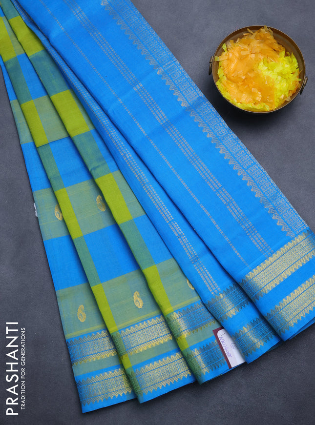 Silk cotton saree light green and cs blue with allover paalum pazham checks & paisley zari buttas and zari woven border