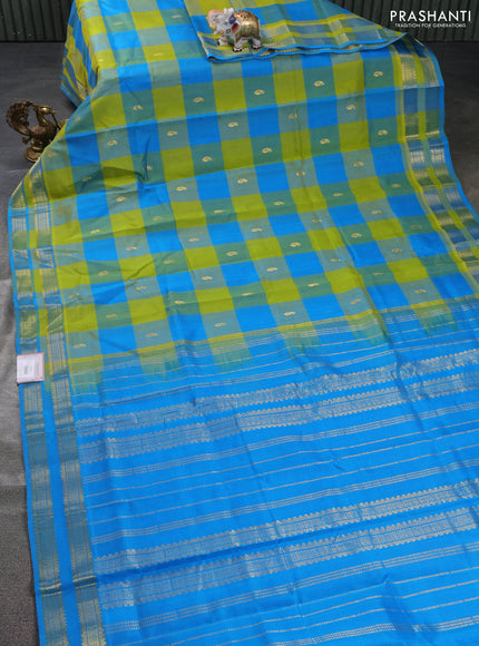 Silk cotton saree light green and cs blue with allover paalum pazham checks & paisley zari buttas and zari woven border