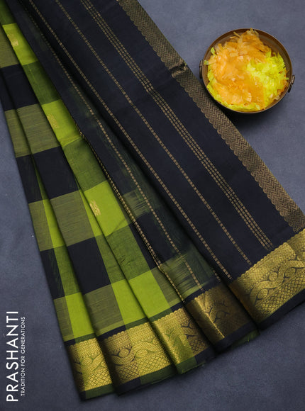 Silk cotton saree light green and black with allover paalum pazham checks & annam zari buttas and zari woven border