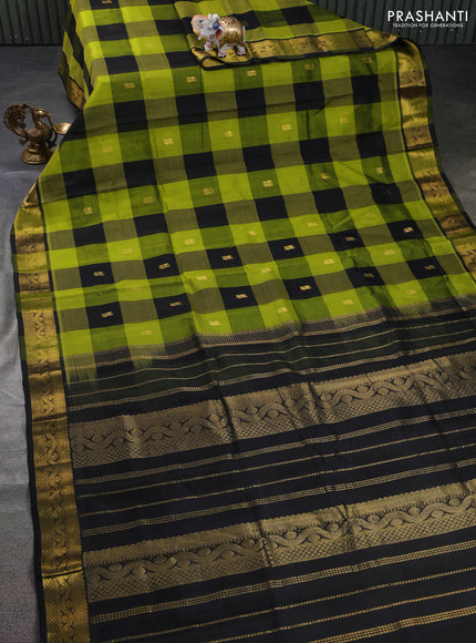 Silk cotton saree light green and black with allover paalum pazham checks & annam zari buttas and zari woven border