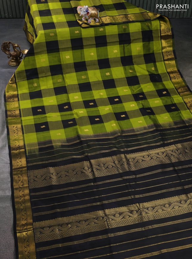Silk cotton saree light green and black with allover paalum pazham checks & annam zari buttas and zari woven border