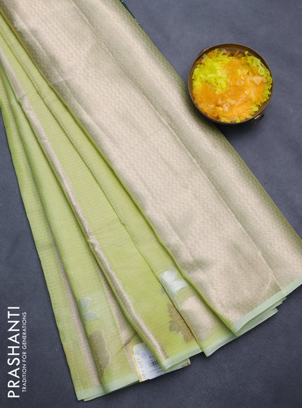Cotton zari kota saree lime green with allover zari weaves and floral design butta border