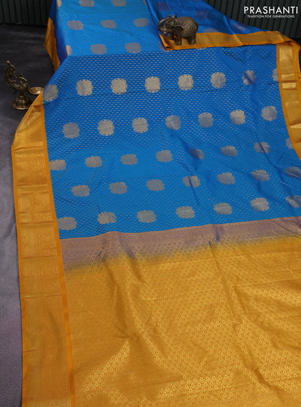 Semi kanchipuram silk saree cs blue and mustard yellow with allover zari weaves & buttas and zari woven korvai border