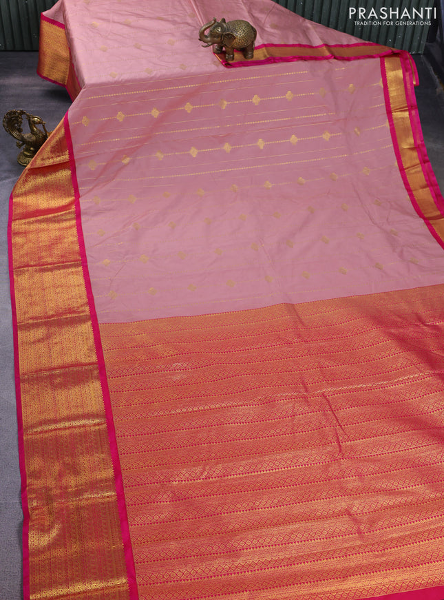 Semi kanchipuram silk saree pastel peach and pink with allover zari weaves and zari woven korvai border